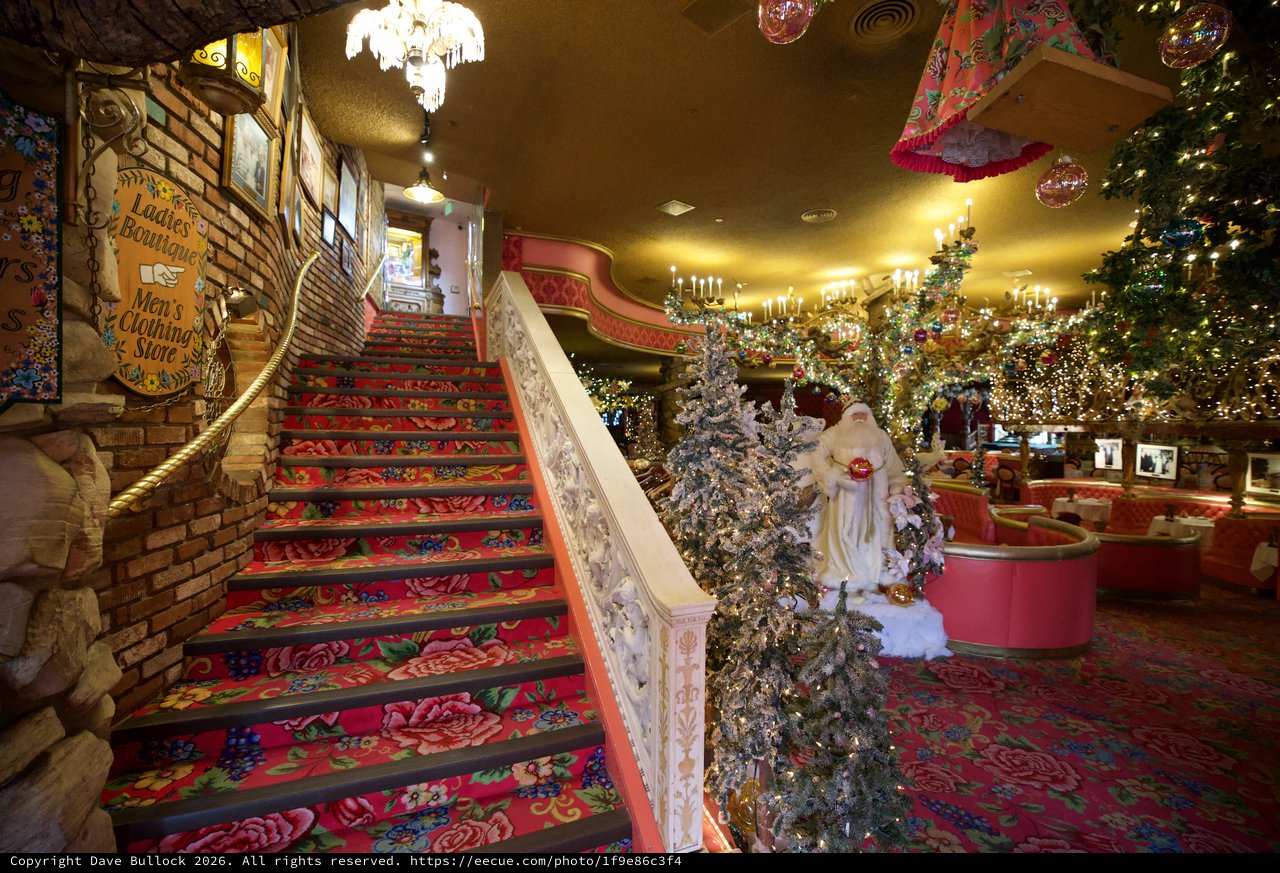 Whimsical Christmas Decorated Interior with Ornate Staircase