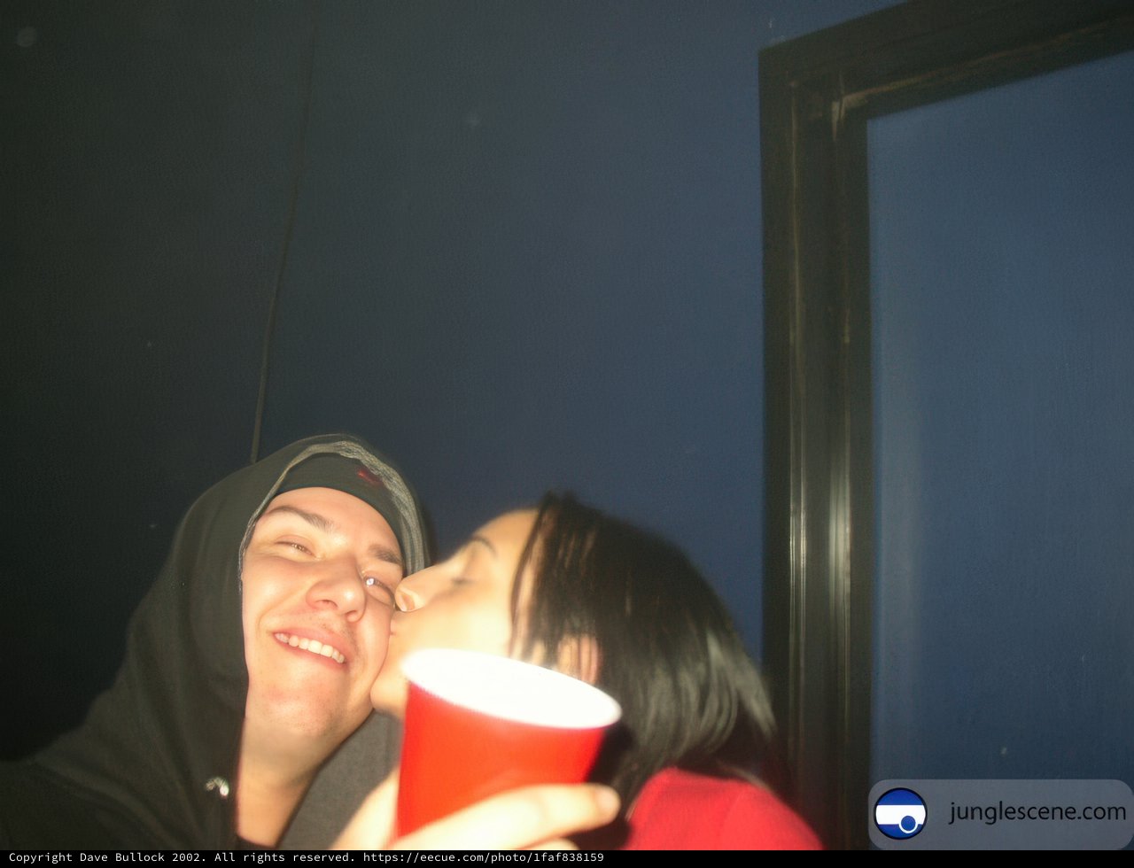 A Romantic Kiss with a Red Cup