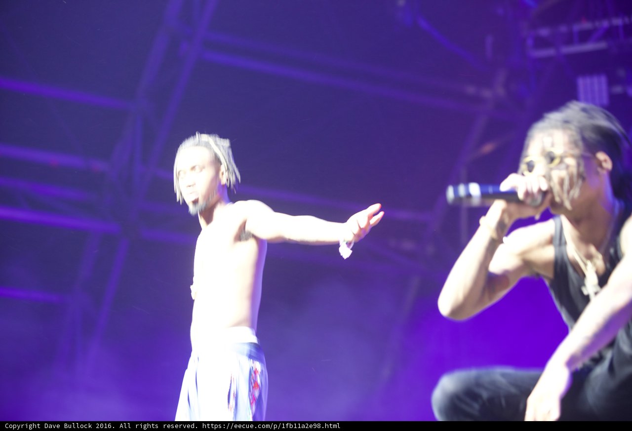 Entertaining the Crowd Caption: Two male performers captivate the crowd with their solo performance on stage at Coachella 2016.