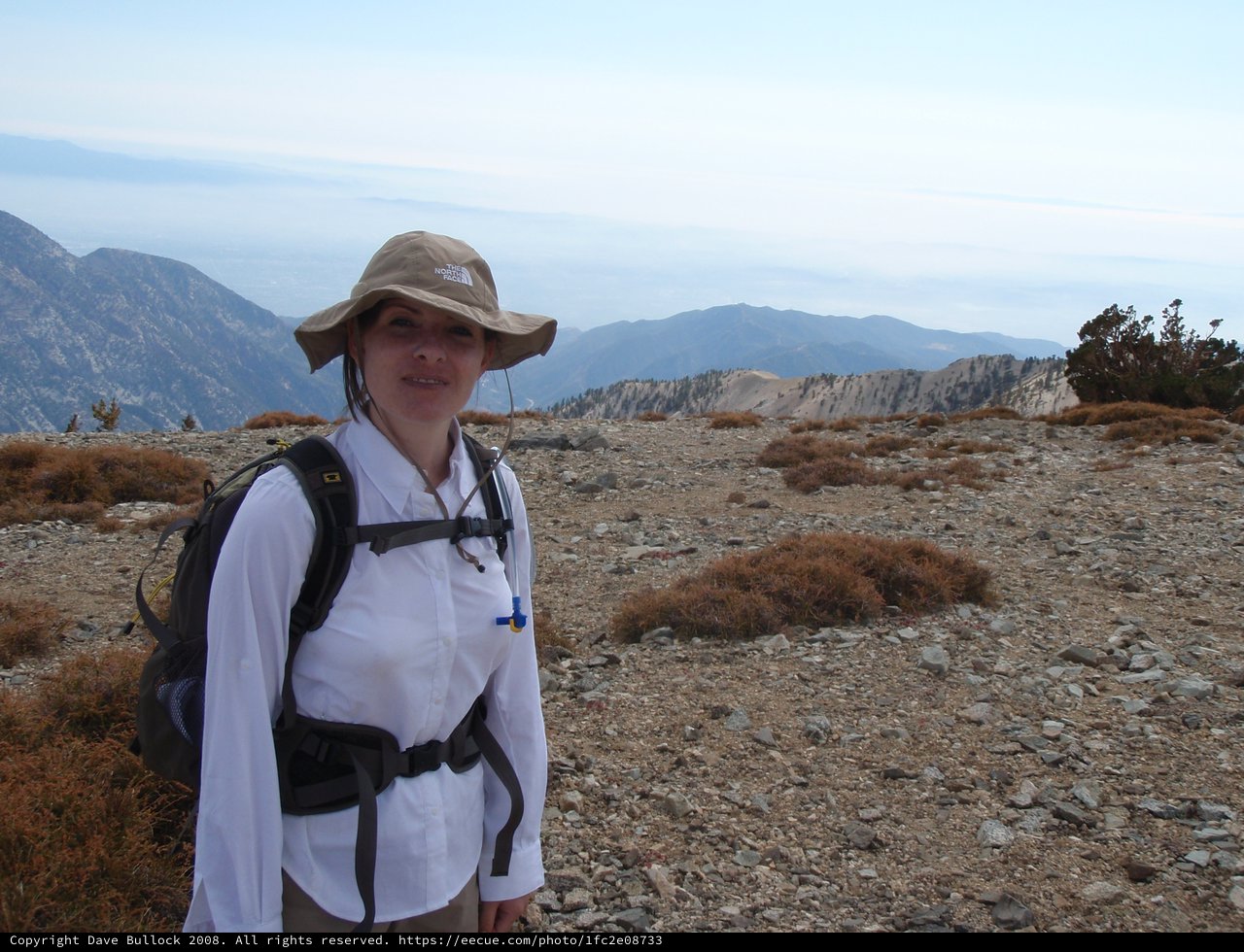 Hiker Pauses at Summit of Mount Baldy