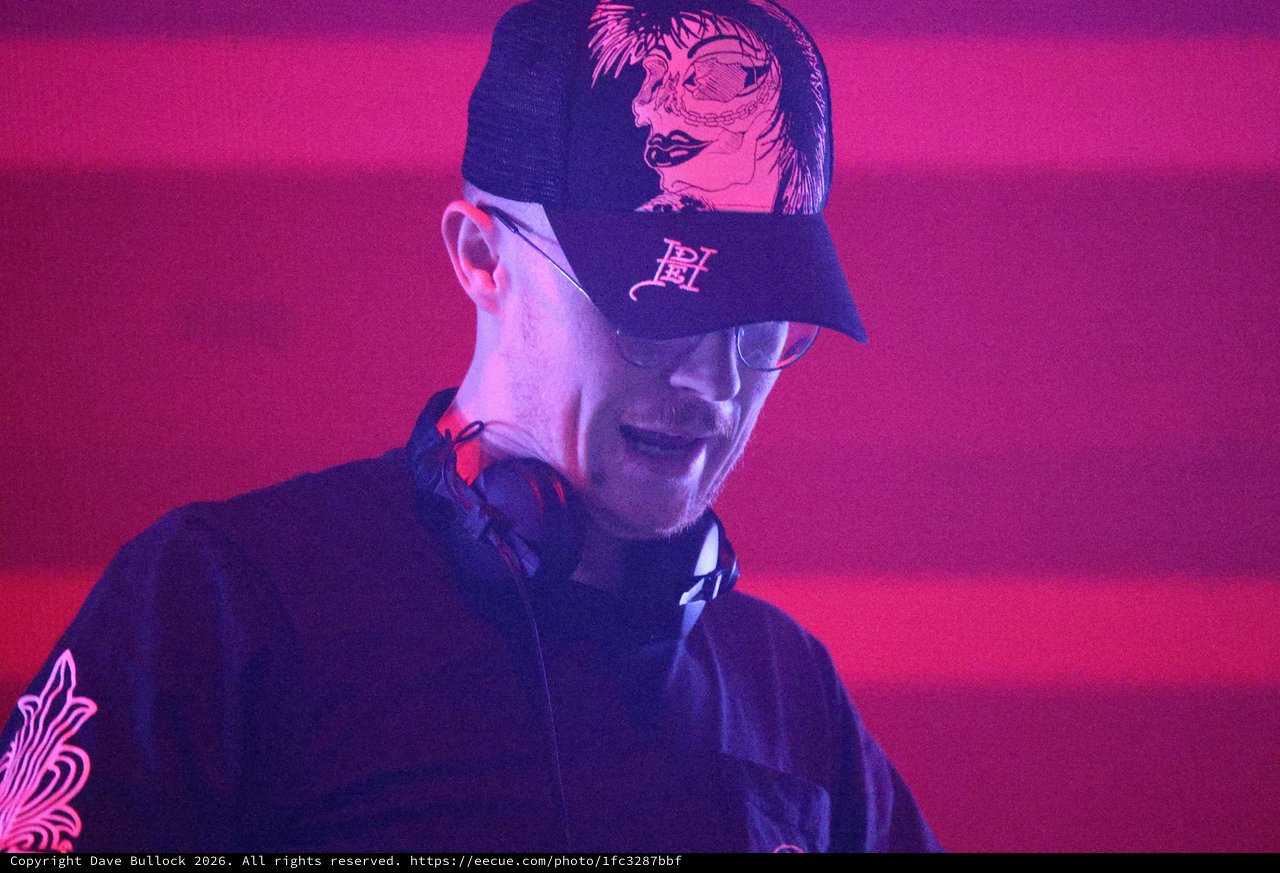 DJ Performs Under Vivid Red Neon Lights at Wobbleland