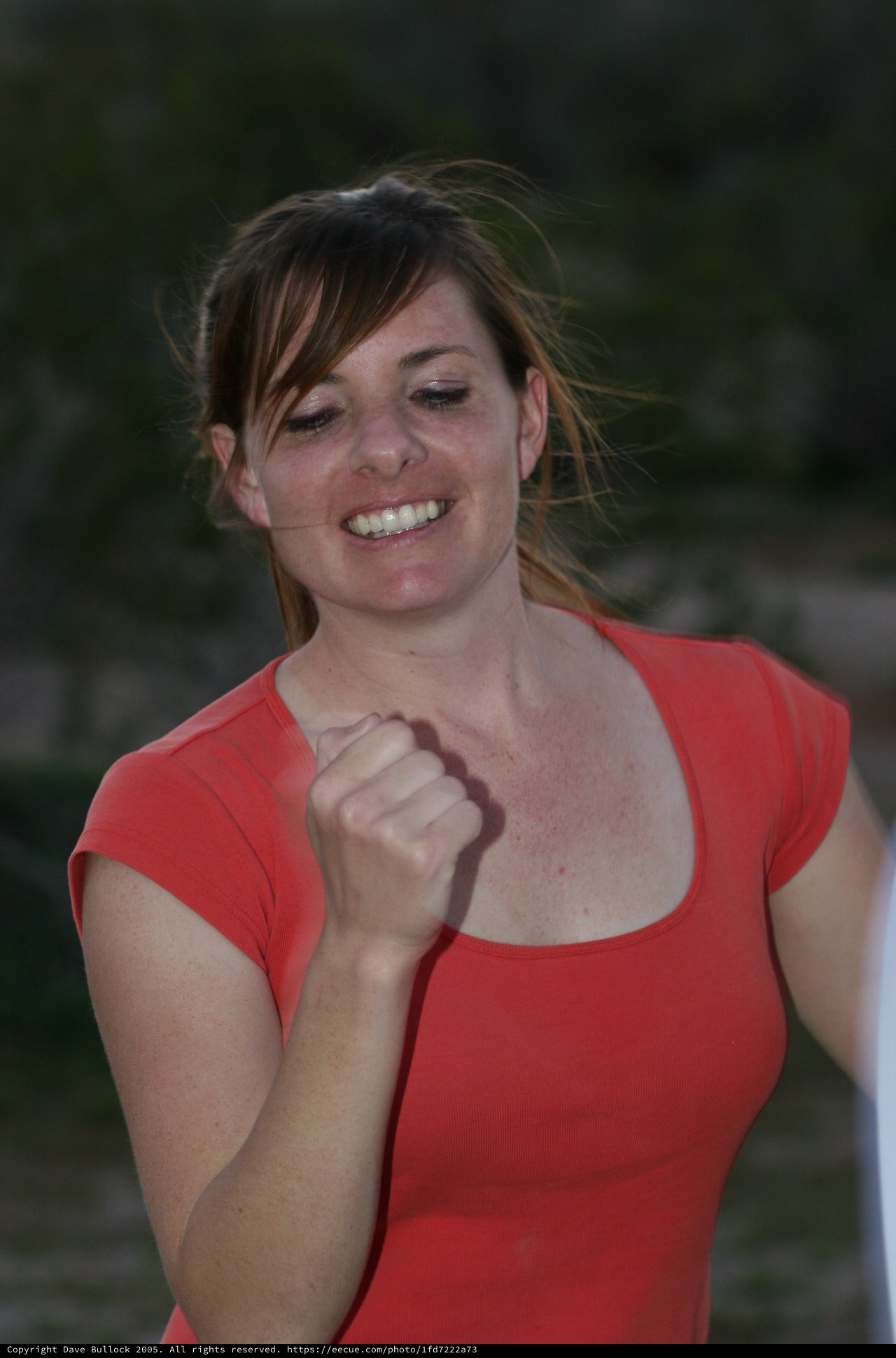 Triumphant Woman Celebrates Victory with Fist Pump