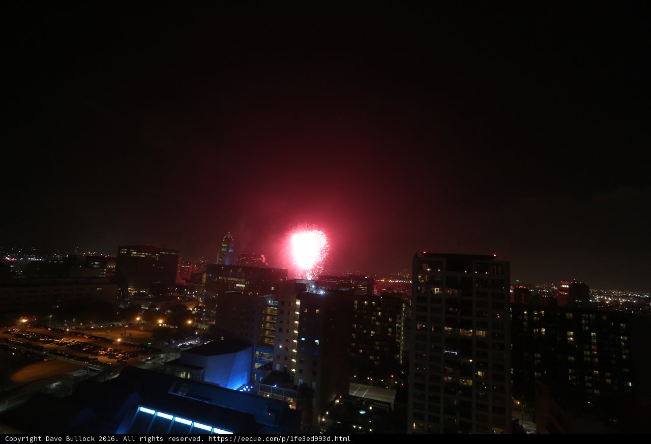 Cityscape Illuminated with a Flare of Fireworks