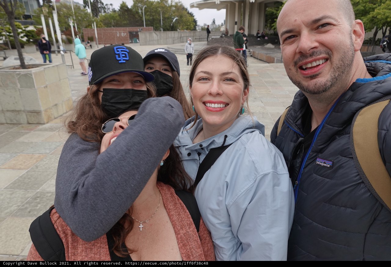 Joyful Group Reunion in Public Plaza