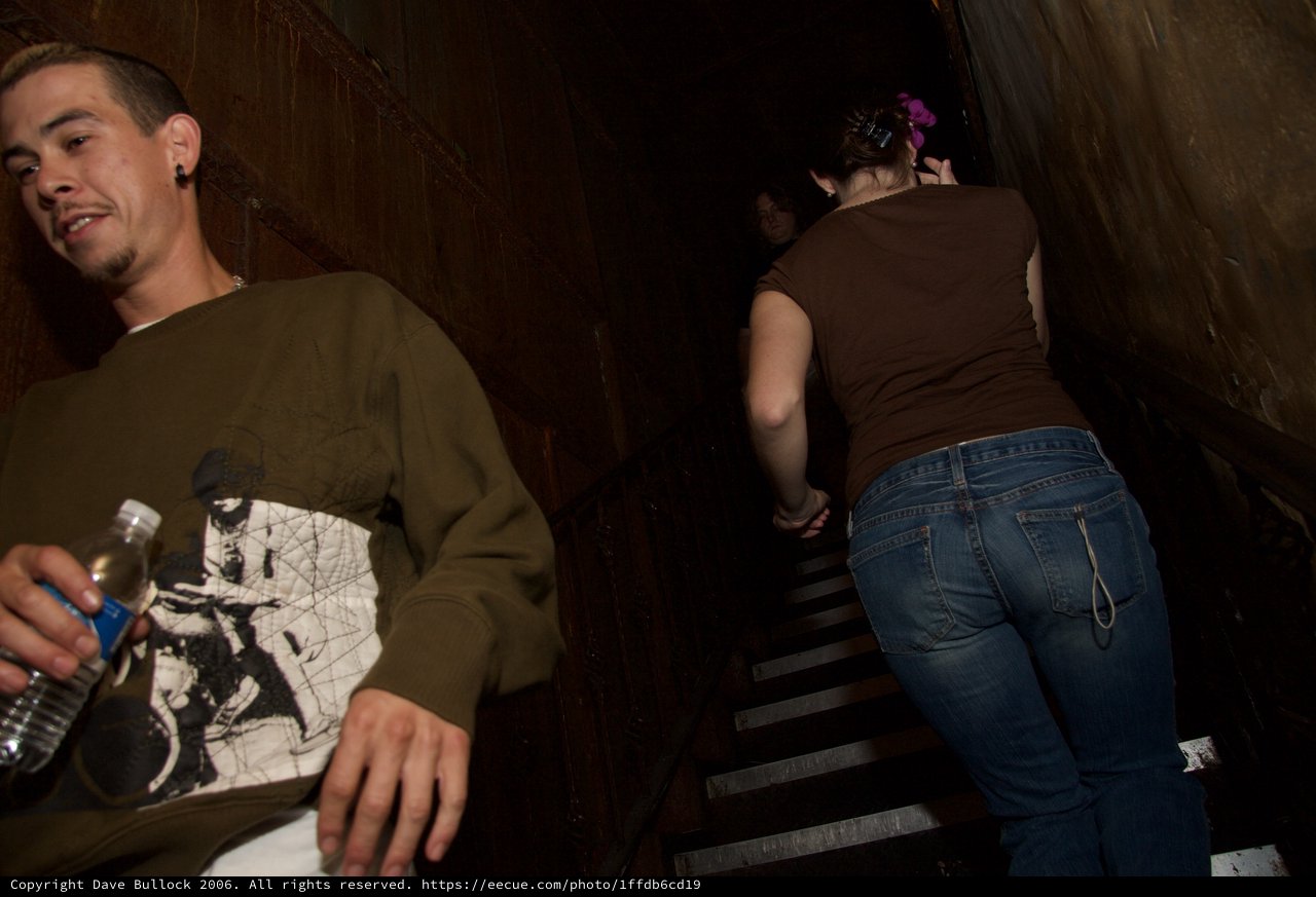 Friends Descending Dark Stairwell at Night Event