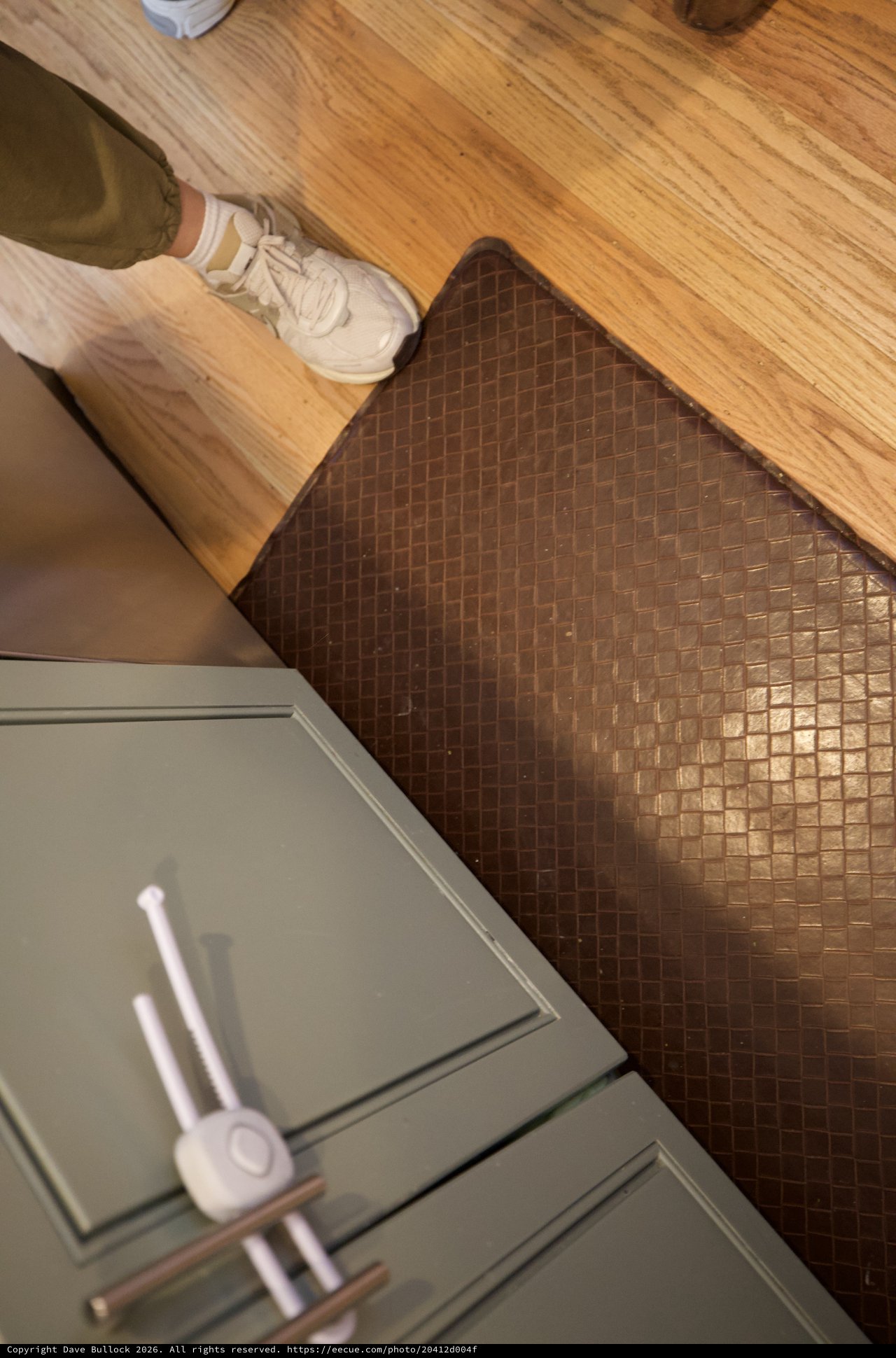 Kitchen Transition: Wood Floor Meets Copper Tile
