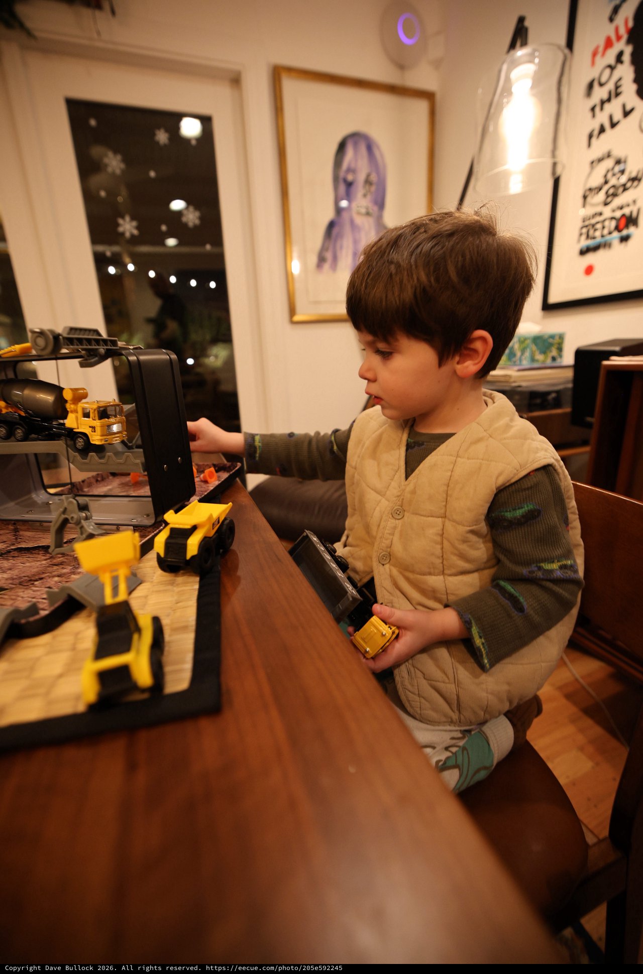 Young Child Playing with Construction Toy Set at Home