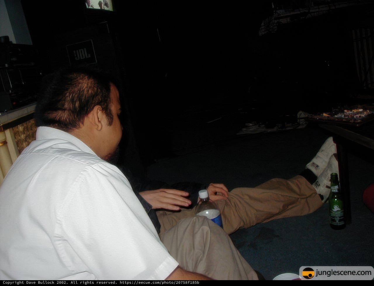 Man enjoying a beer in the night