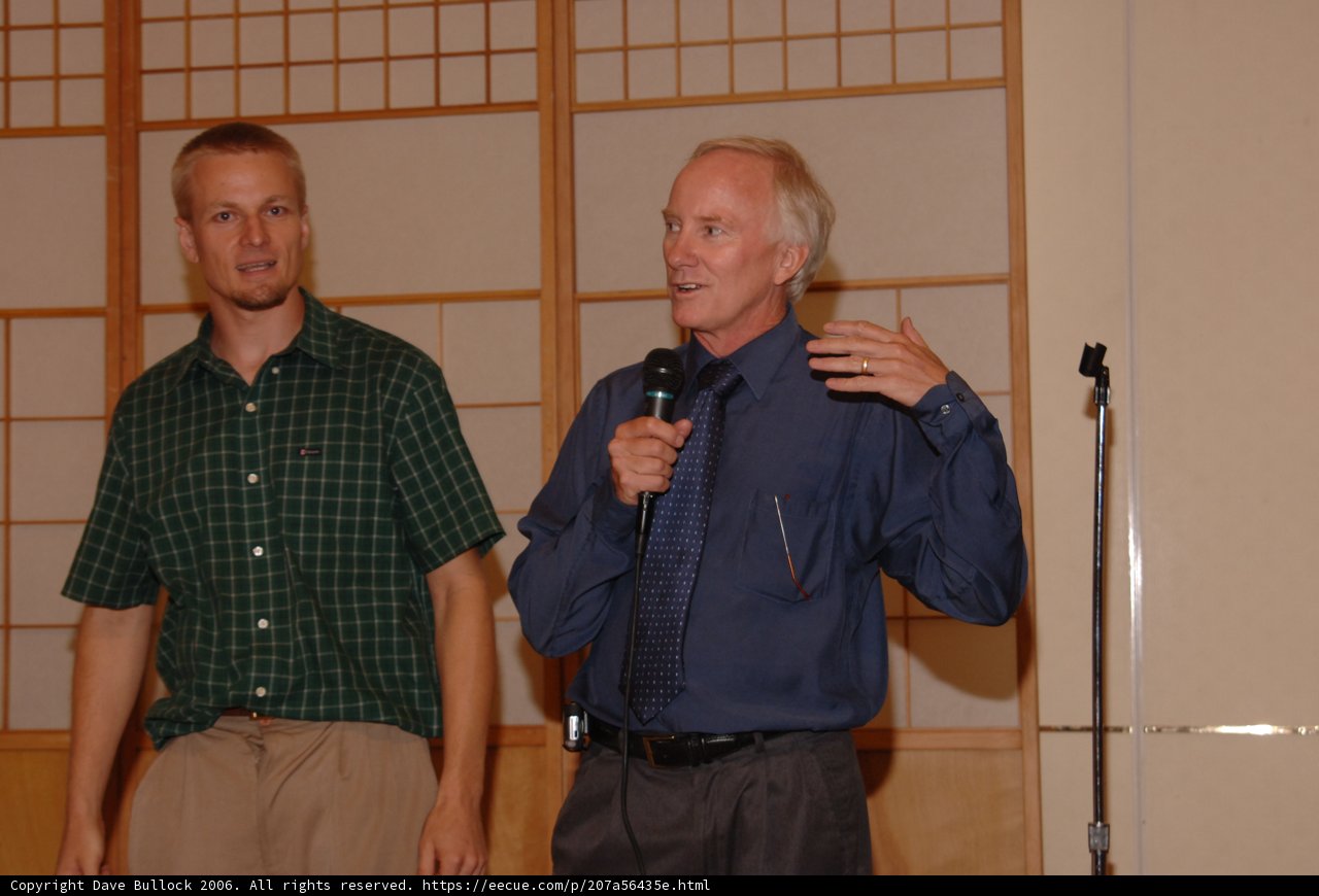 Two Men Speaking In Formal Wear