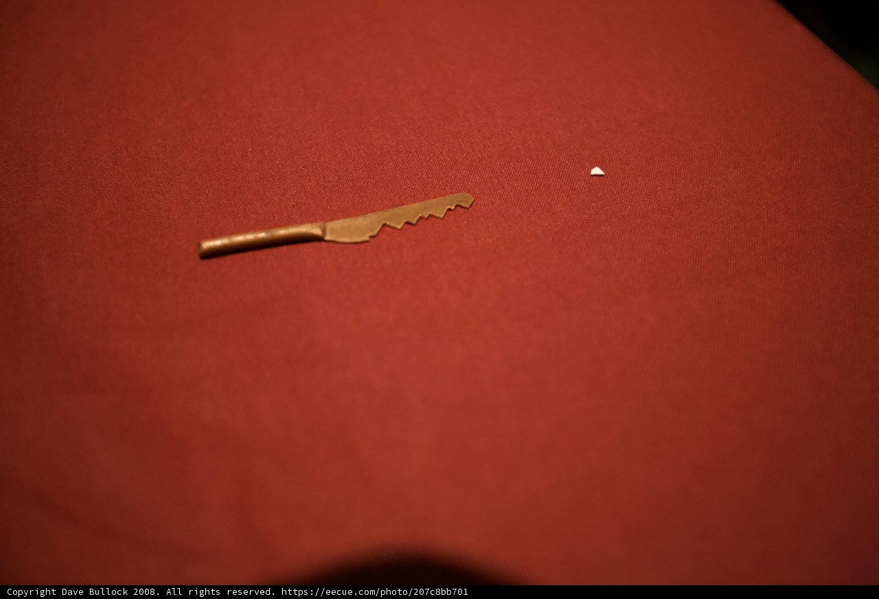 Small knife and paper on red cloth