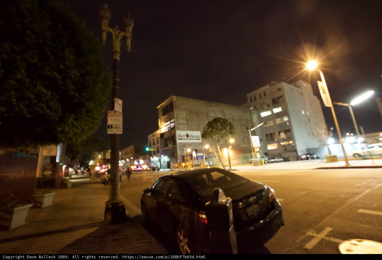 Parked Coupe on a Metropolis Street