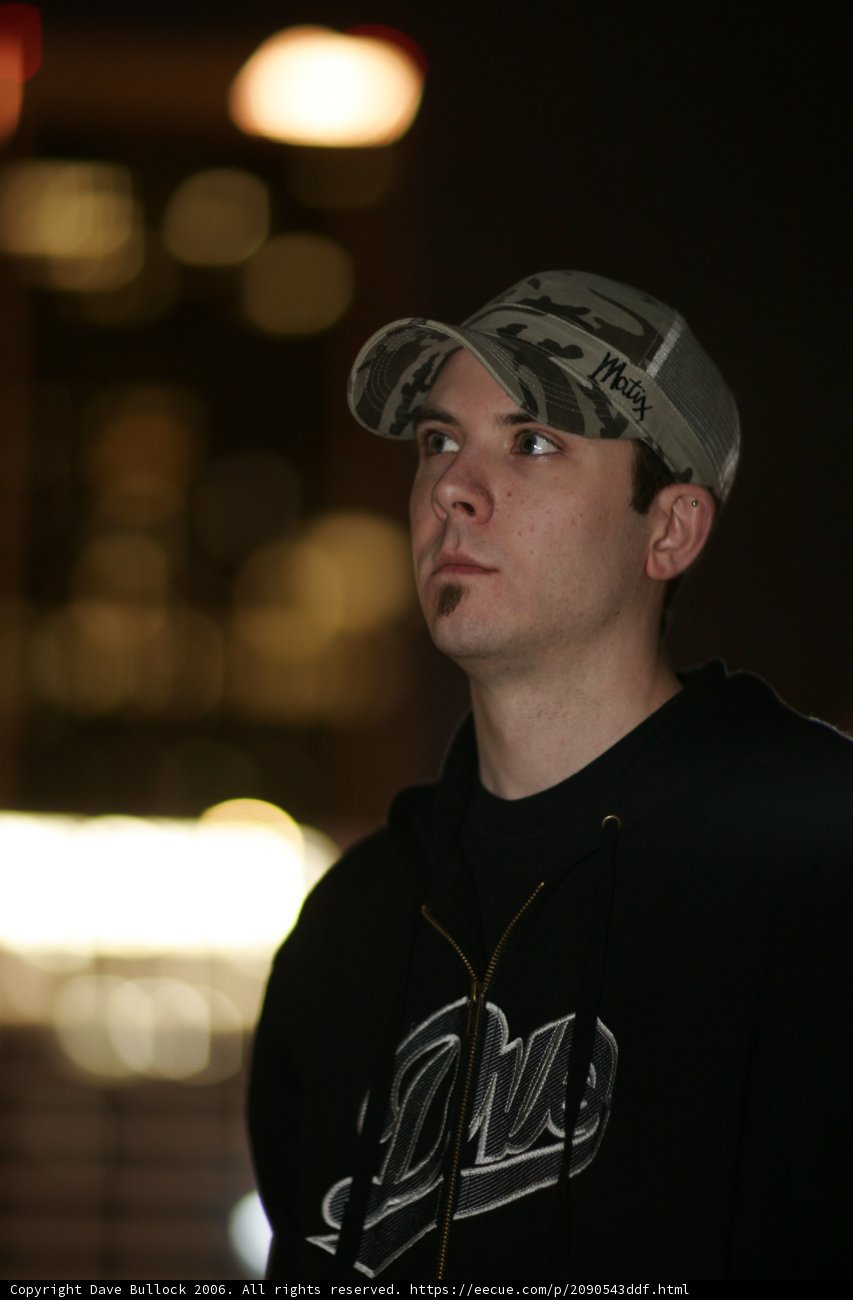 Black Jacketed Man with Baseball Cap