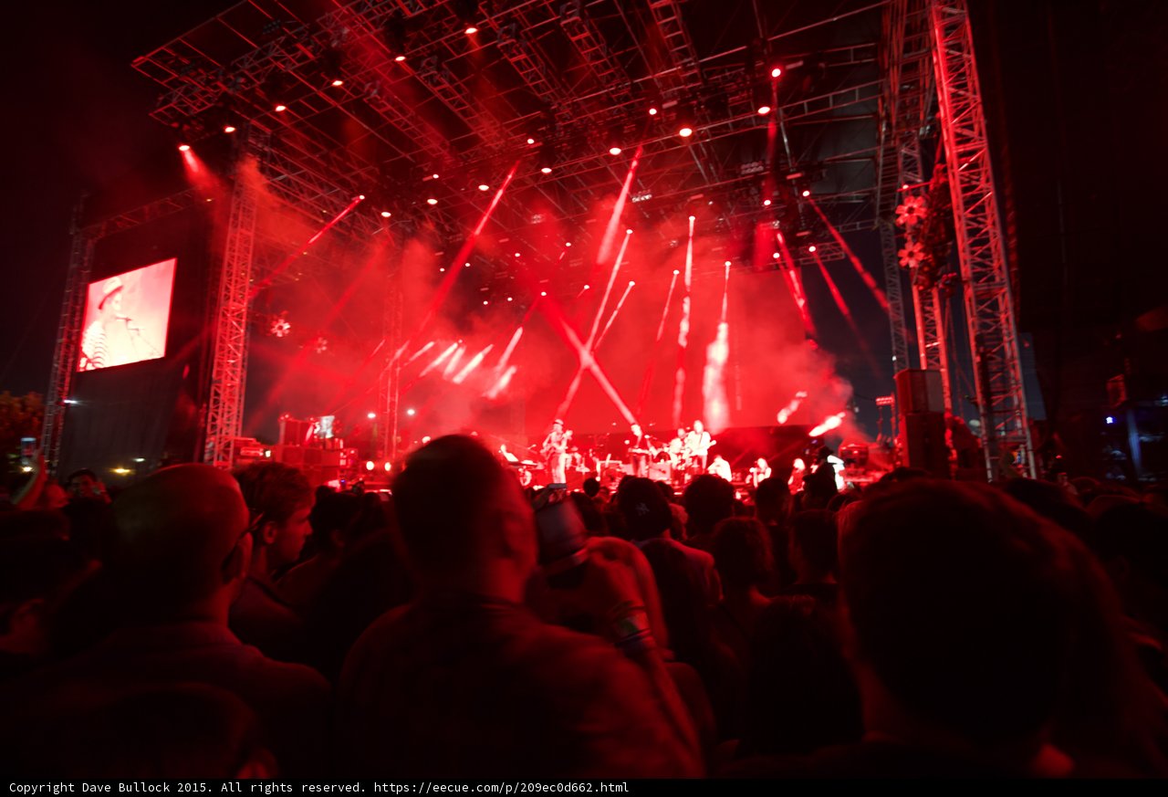 Belle and Sebastian Wide Stage Red Lighting Video Screen Spotlight Beams Crowd Night