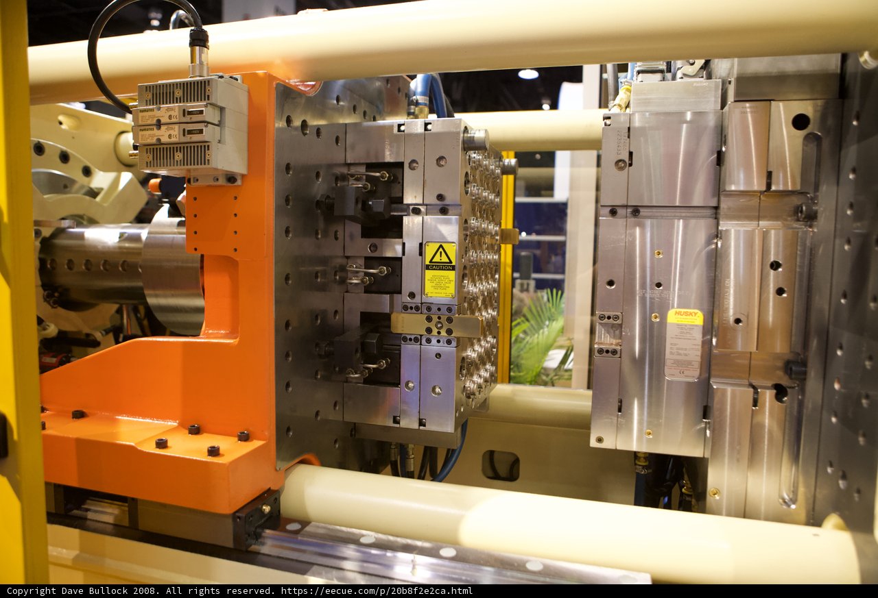 Industrial Machine with Metal Frame and Yellow Handle