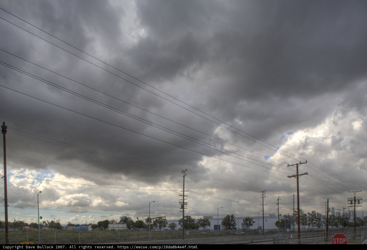 Moody Skyline with Power Lines and Train