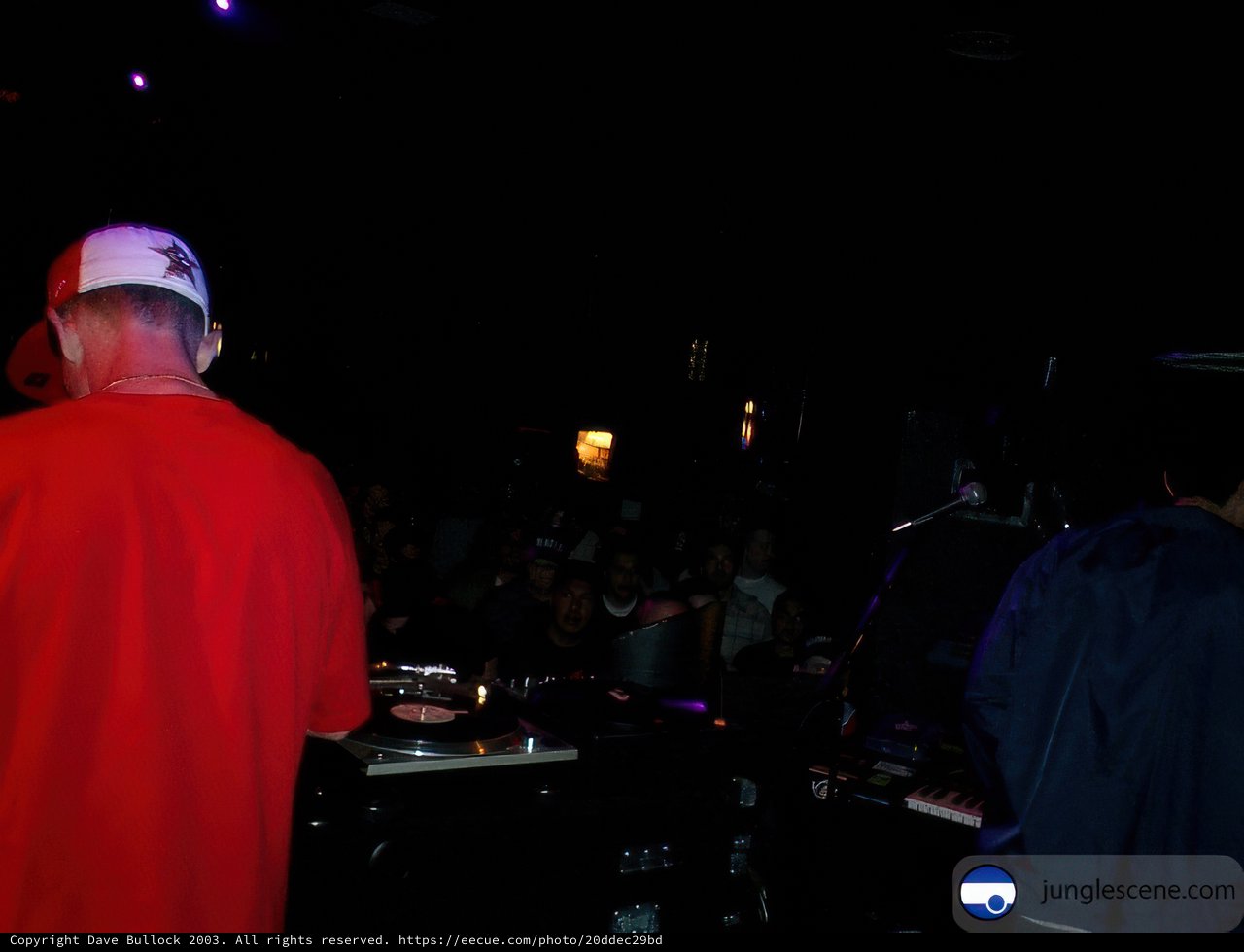 Nightclub Entertainer in Red Shirt and White Hat