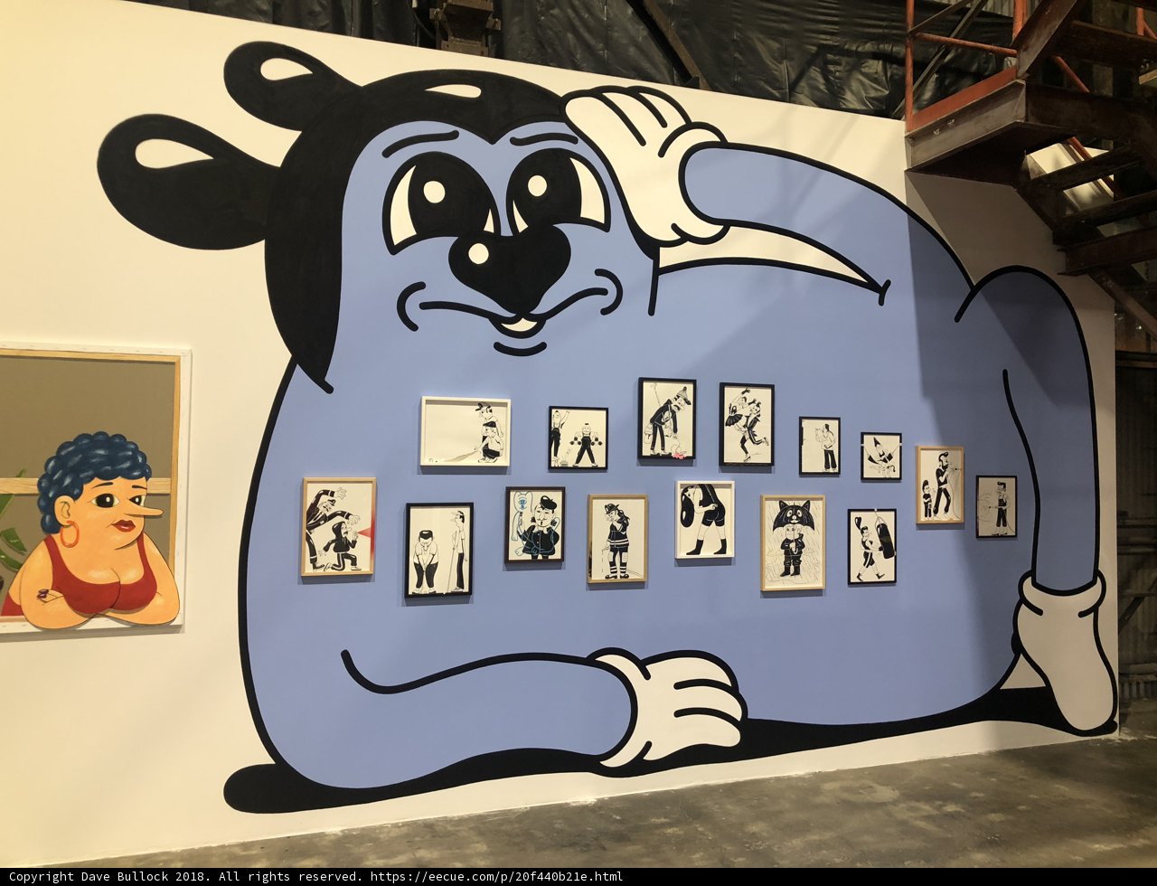 Blue Character Takes Over Art Gallery