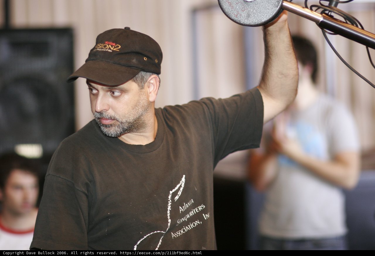 Man in Black Shirt Holding Microphone