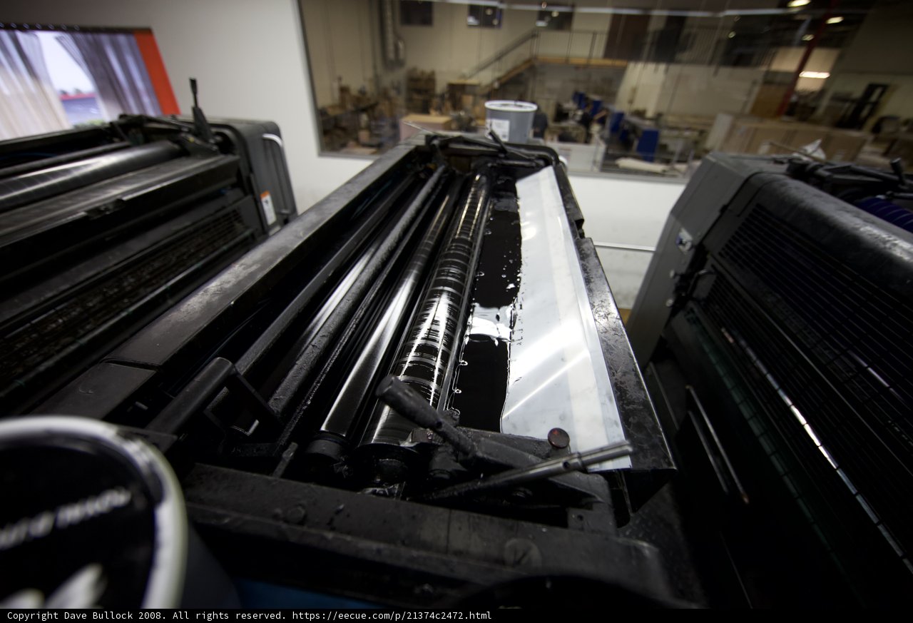 Large Printer in a Room Full of Machines
