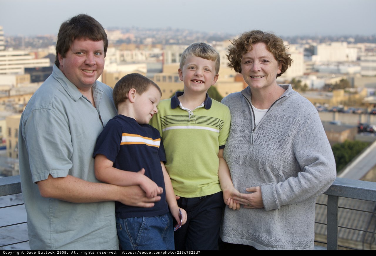 Family Portrait on Urban Rooftop at Dusk