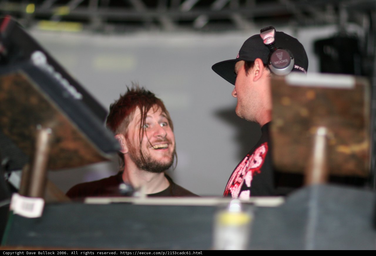 Two Men Laughing at a Music Event