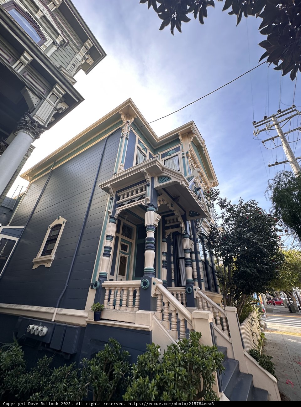 Blue House with a White Porch and a Blue Roof