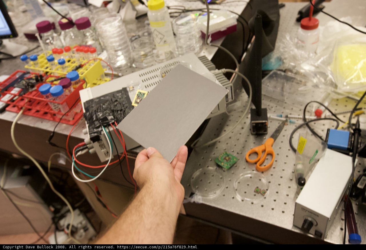 Lab Technician inspecting a Circuit Board