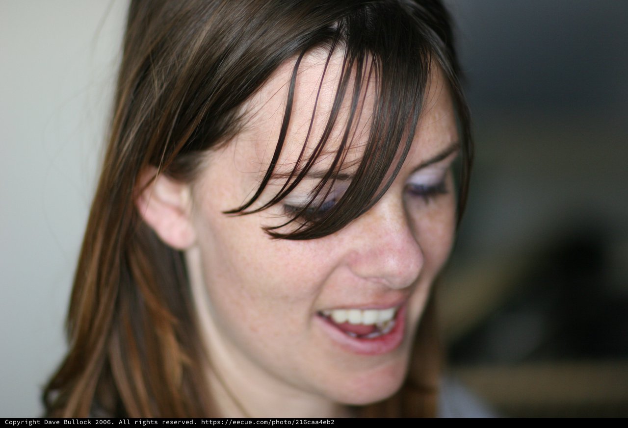 Candid Smile of a Young Woman with Freckles