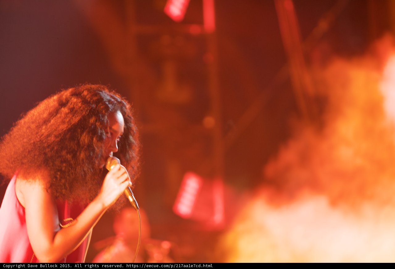 Solange Profile Head Bowed Singing Orange Smoke Intimate
