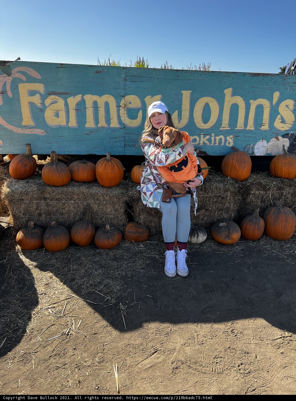 Portrait of a Smiling Teen in a Pumpkin Patch