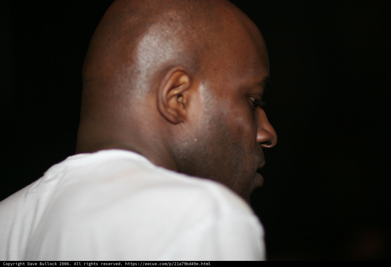 MC Q: Shaved Head Portrait