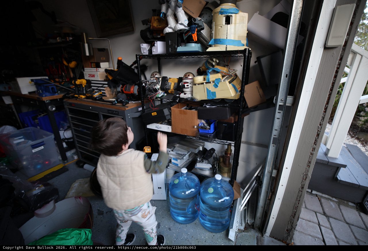 Child Organizing Tools in Cluttered Workshop Storage