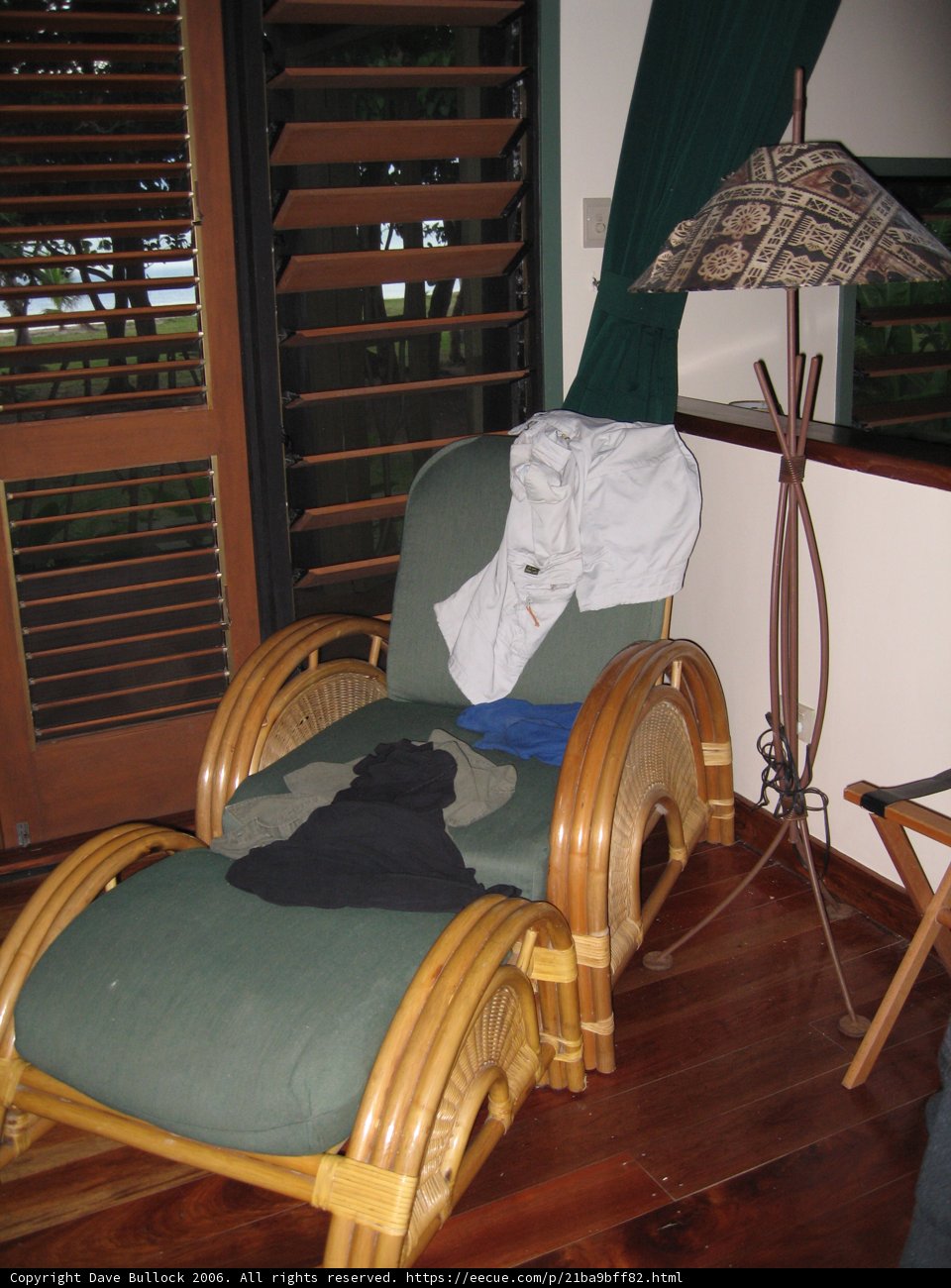 Cozy Armchair and Foot Rest on Hardwood Floor