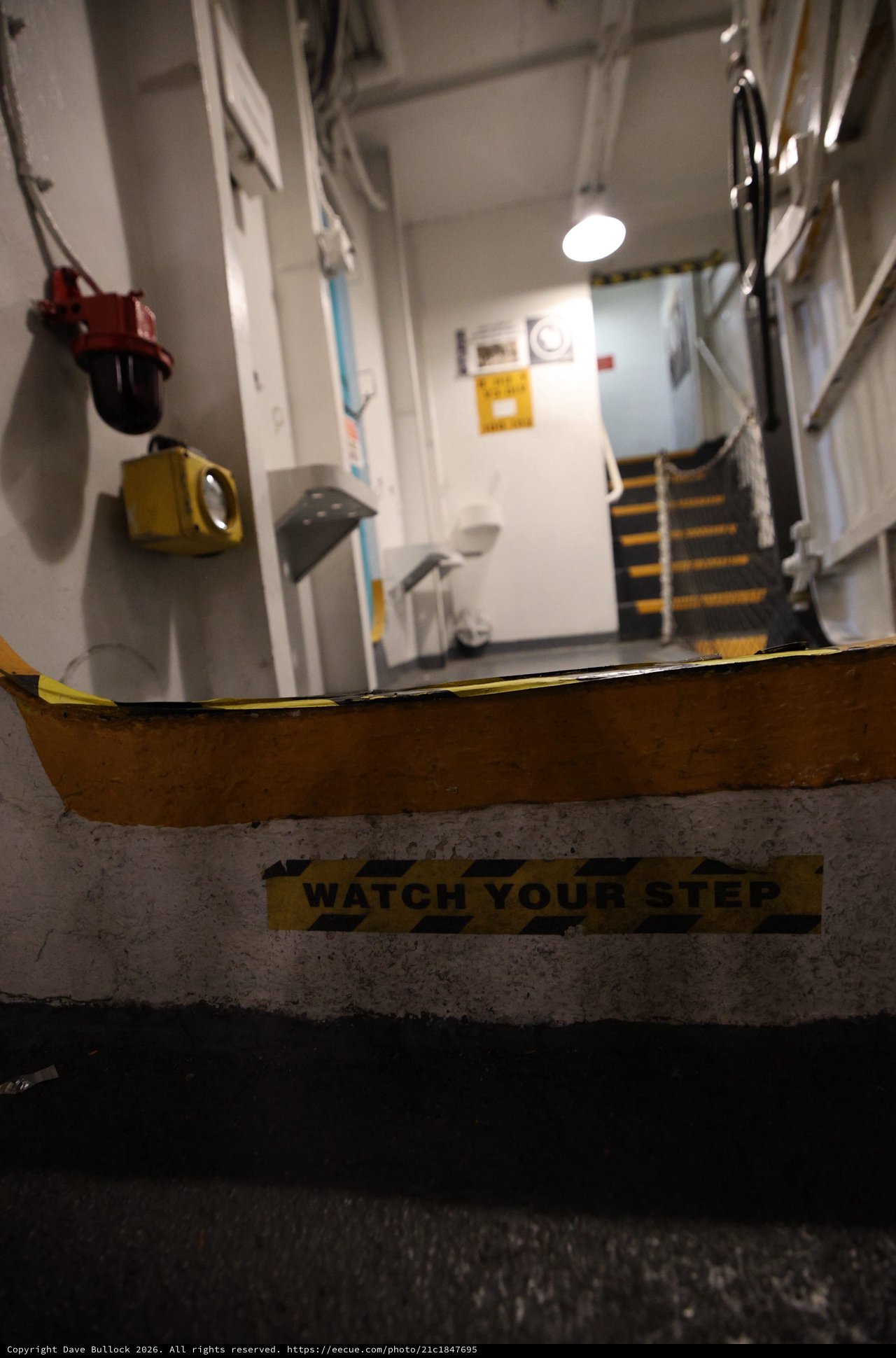 Watch Your Step Warning on USS Hornet Naval Vessel
