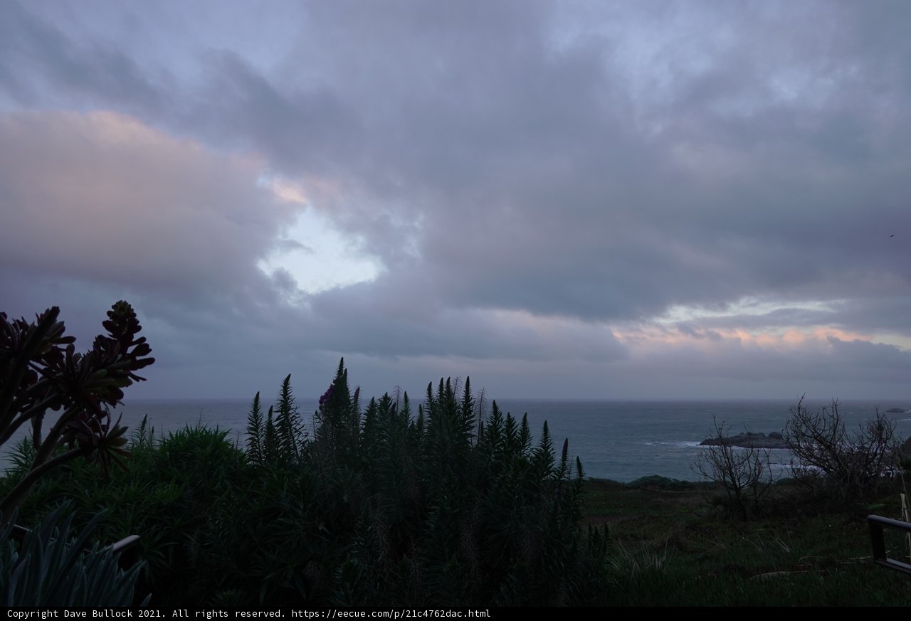 Hillside Overlooking the Majestic Ocean and Clouds