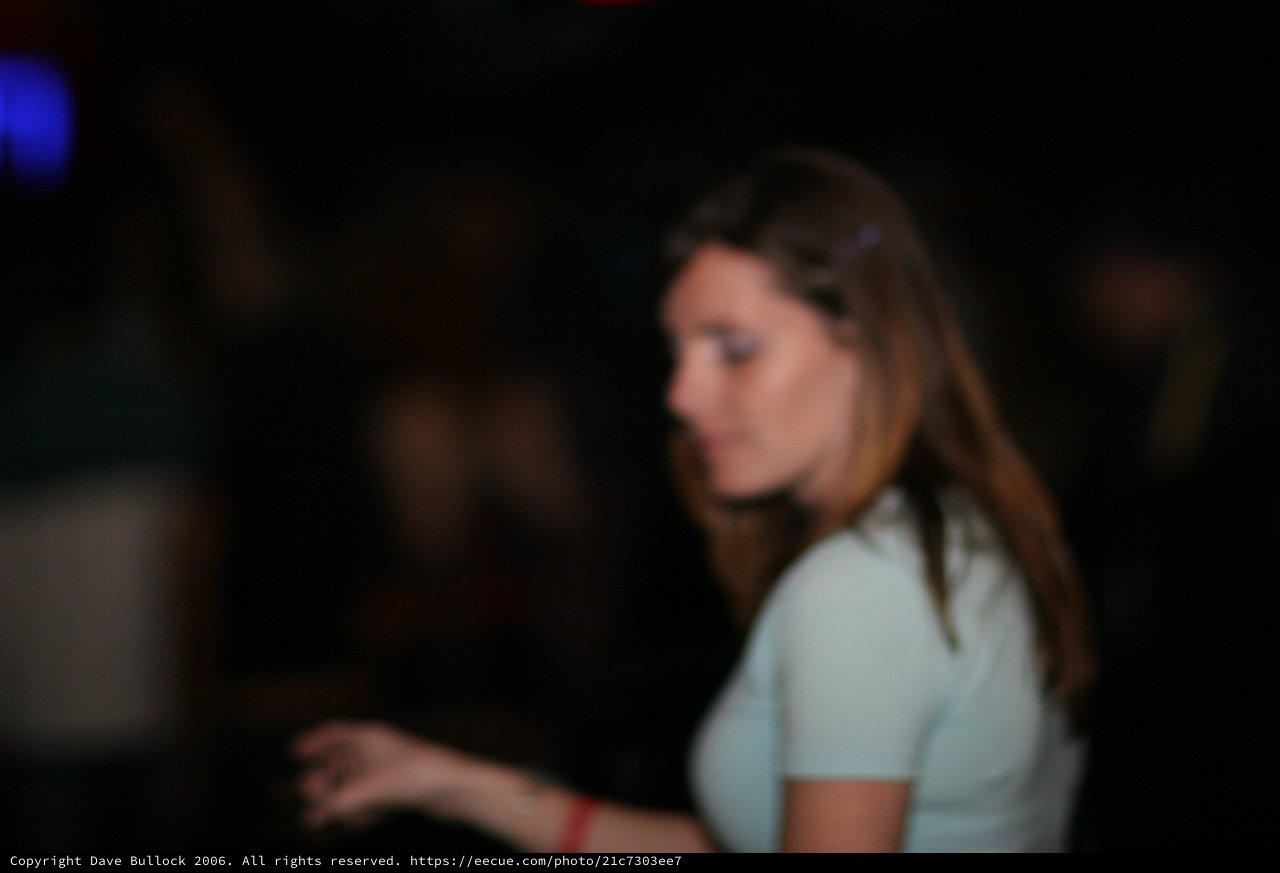 Young Woman Lost in Thought at Nightclub