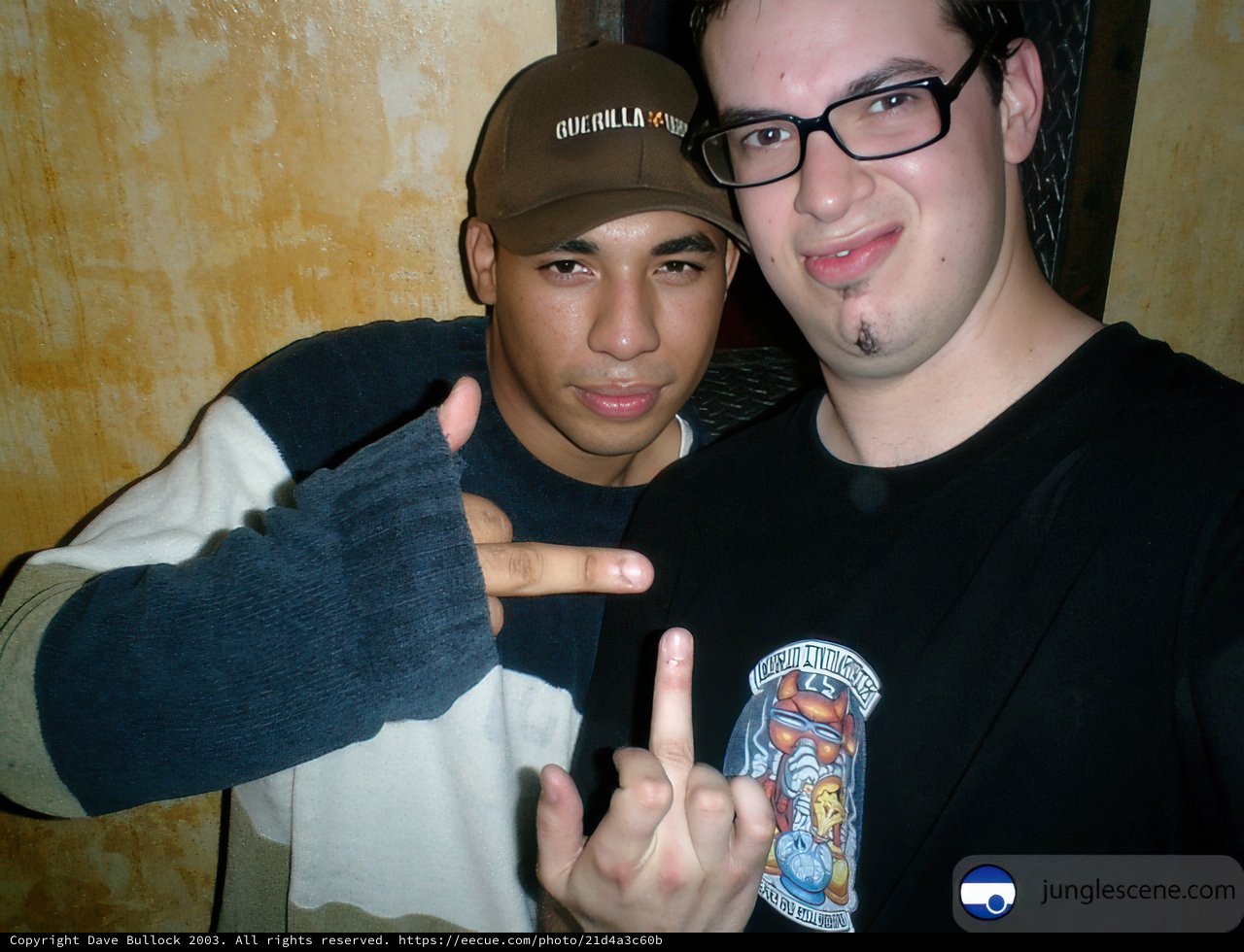 Two Men Strike a Pose with Peace Sign