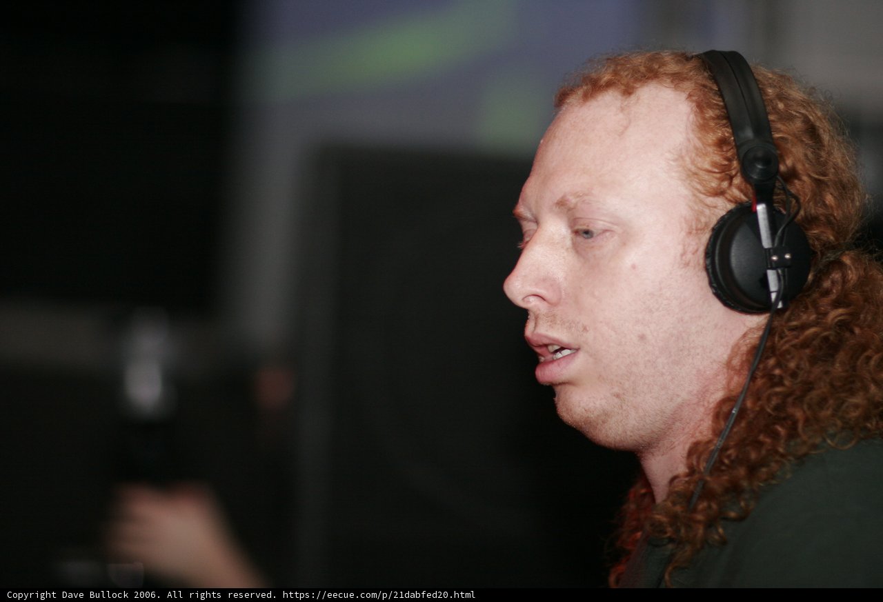 Red-haired man rocks out with headphones
