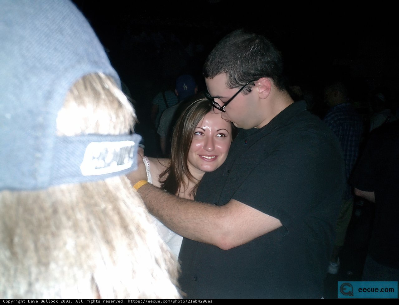 An Endearing Hug at a Nighttime Party