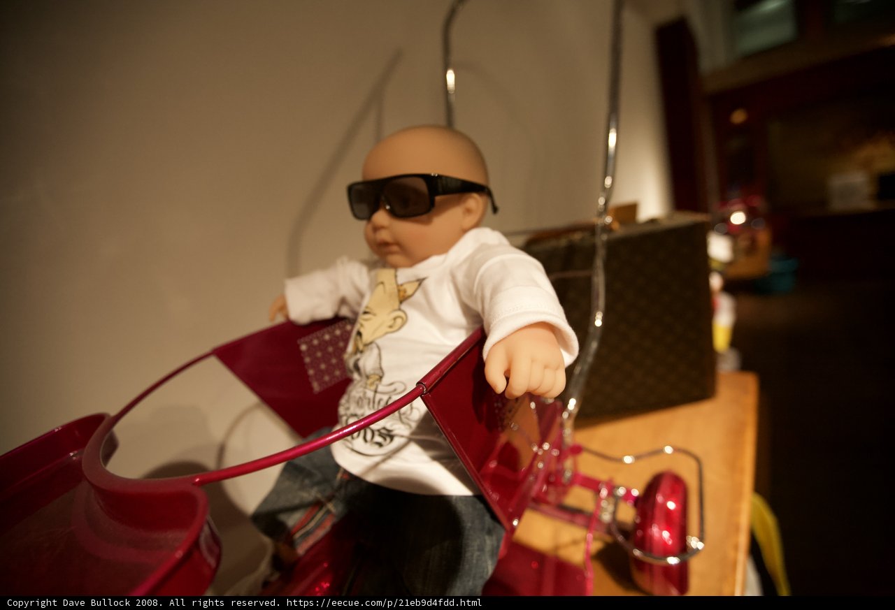 Stylish Doll on a Red Bike