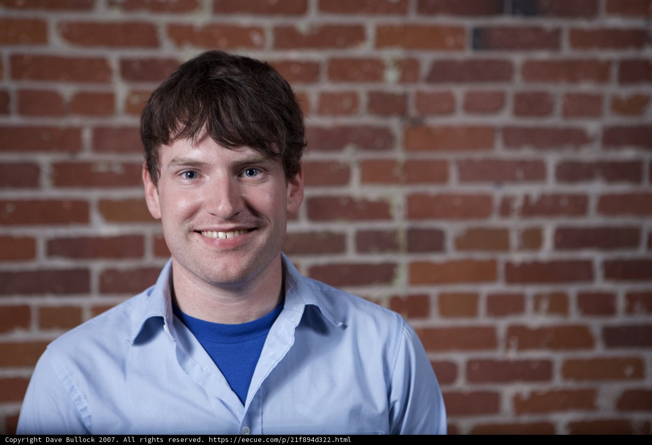 The Happy Man Against The Brick Wall