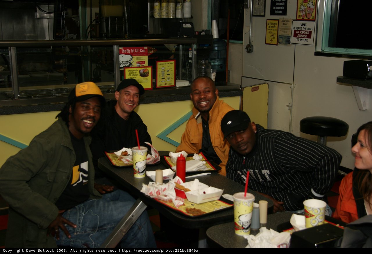 Friends Laughing Over Fast Food Late Night