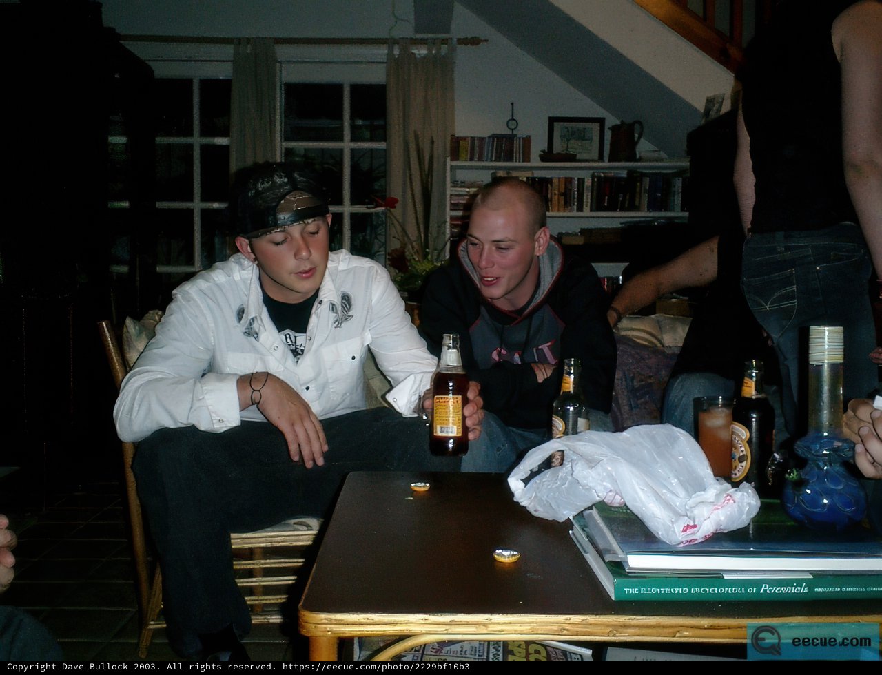 Man in a Black Hat at a Dining Table