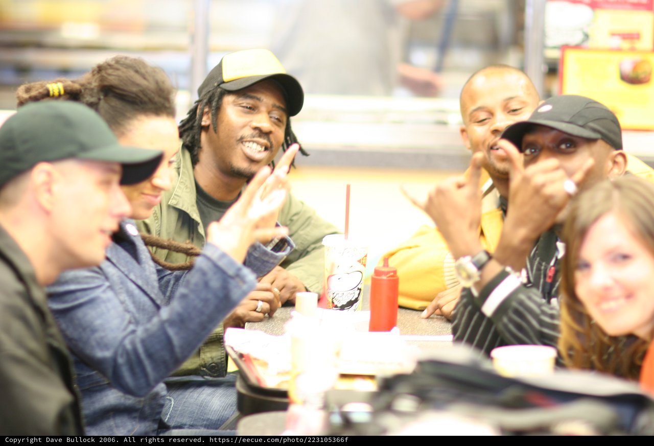 Friends Laughing Together at Fast Food Restaurant