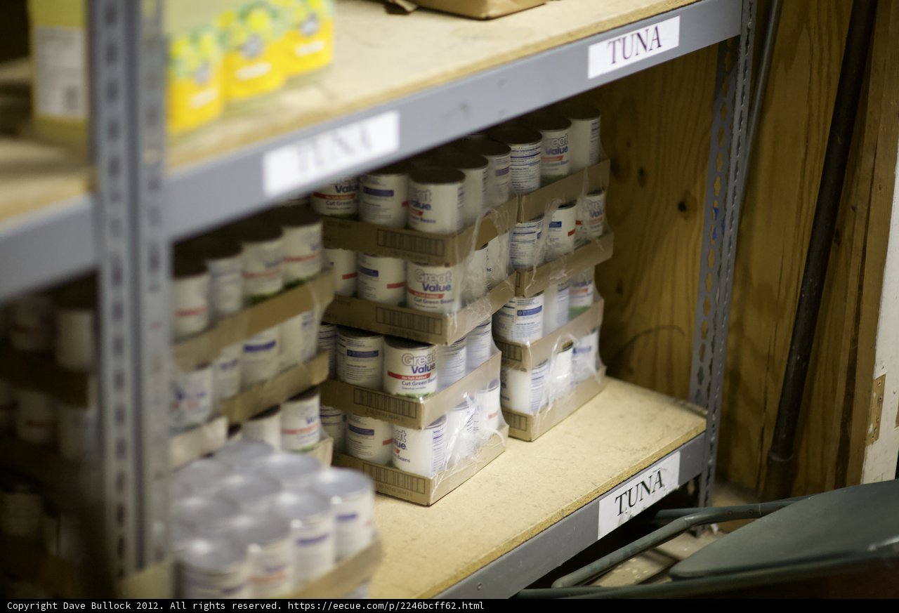 A Colorful Array of Containers on a Wood Shelf