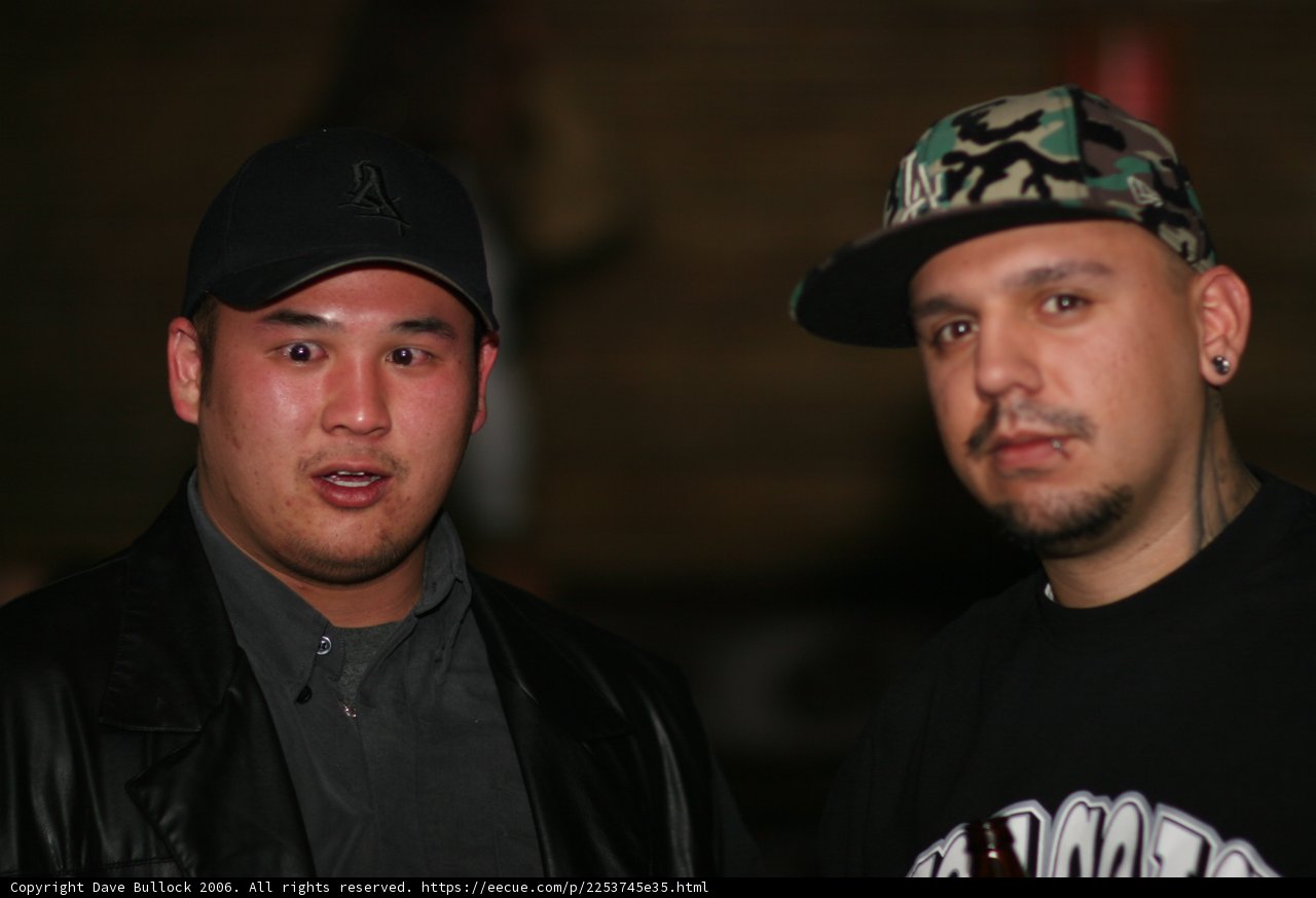 Two Men in Jackets and Baseball Caps