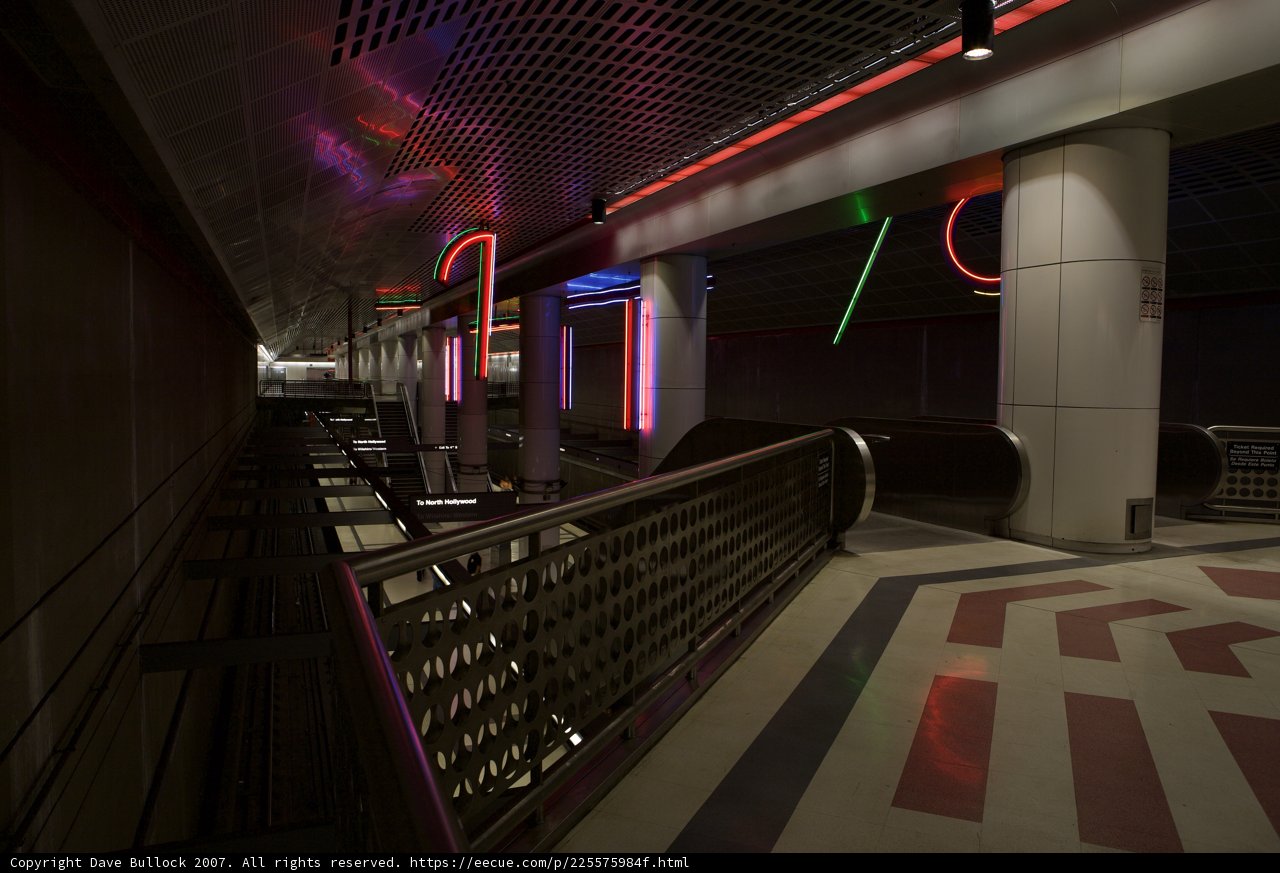 Neon-lit Corridor at Train Station