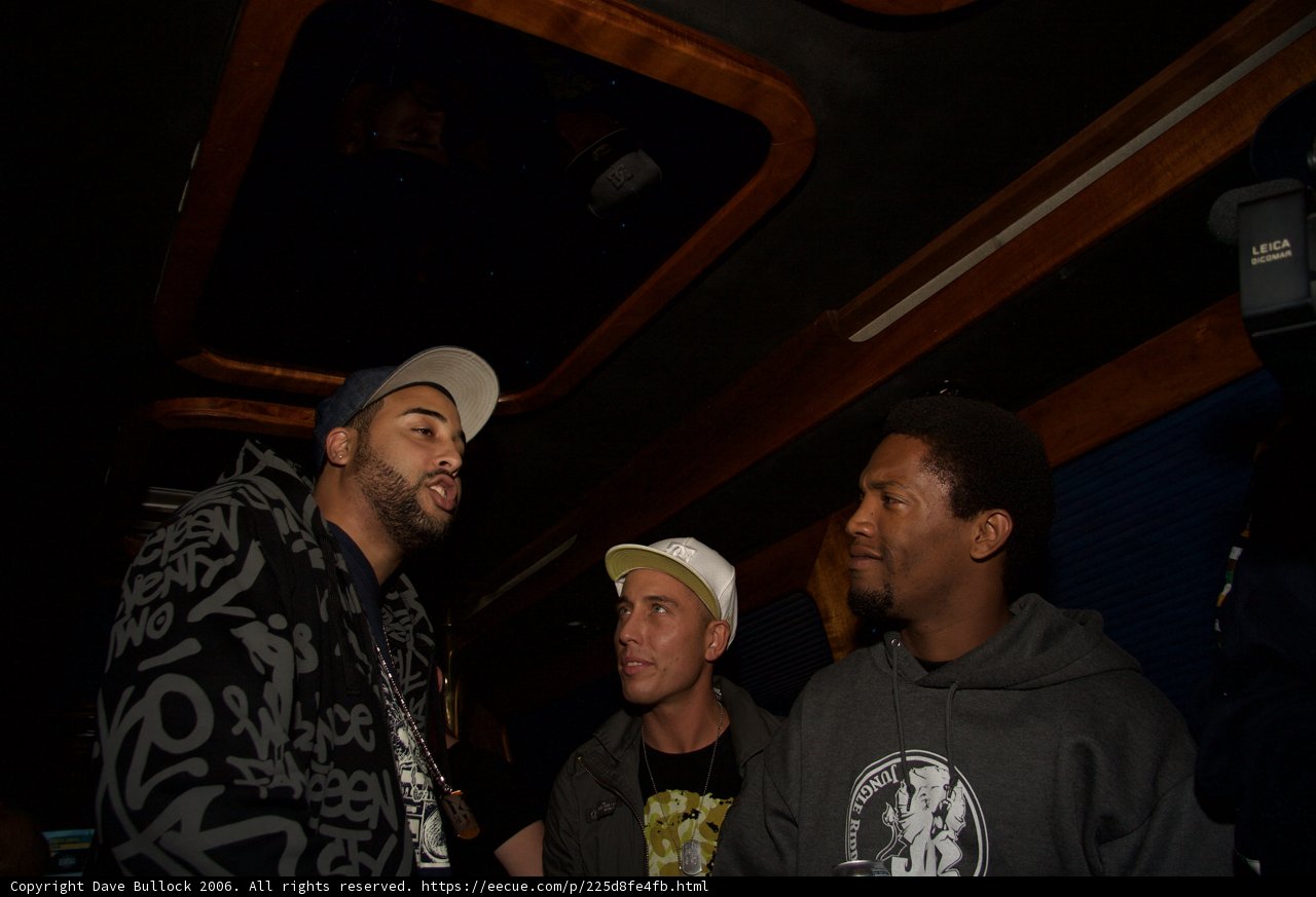Three Men Discussing at the Club