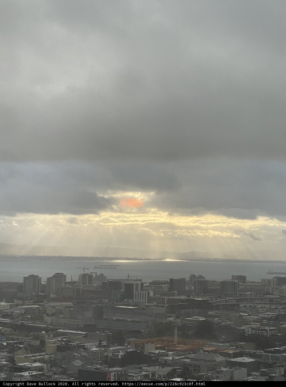 Glorious City Sunrise through Cumulus Clouds