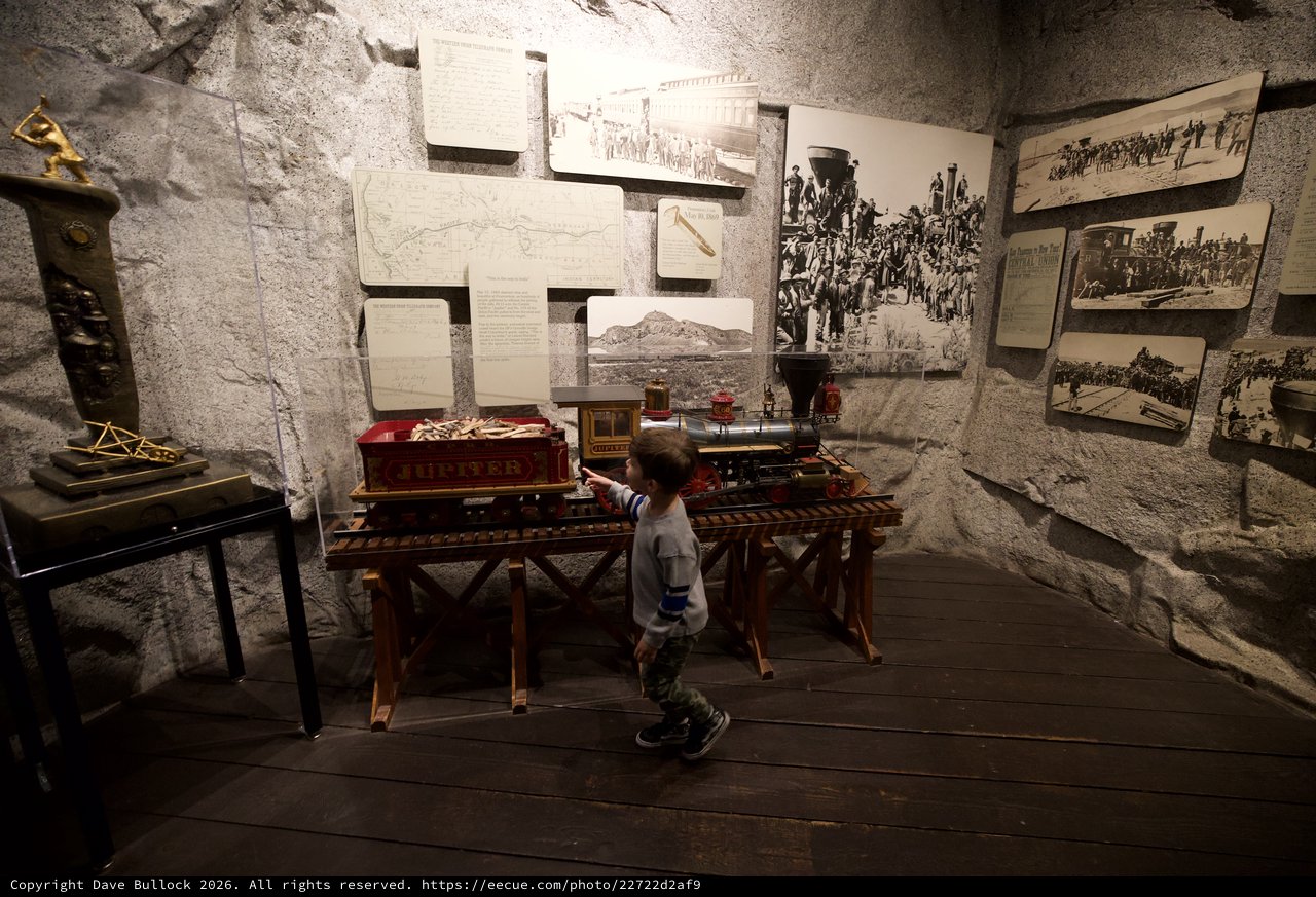Young Boy Explores Historic Railroad Museum Display